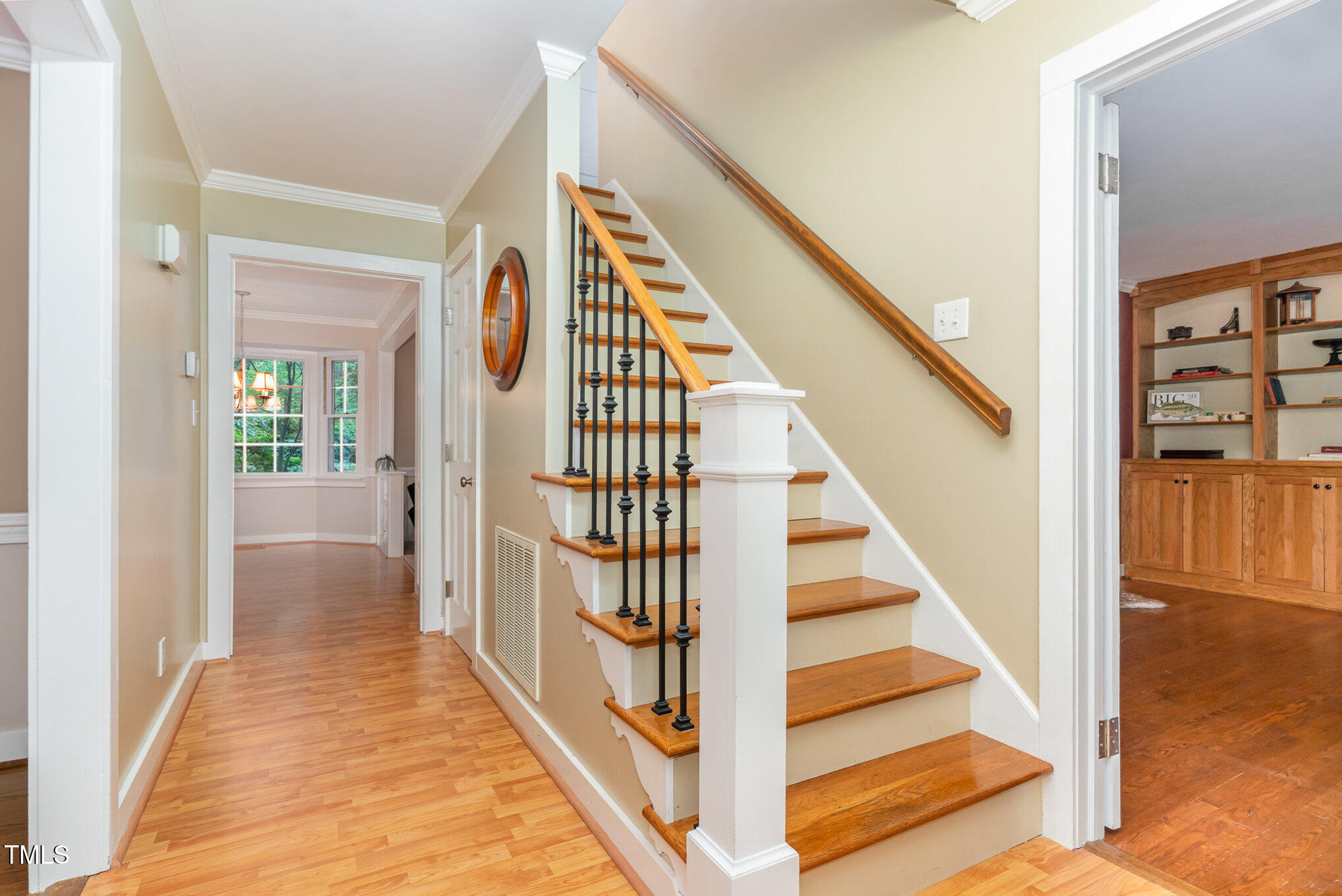 12709 Timberlane Court Raleigh, NC 27613 - Photo 10 of 44 a view of a hallway with wooden floor and staircase