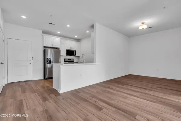 a view of kitchen with wooden floor