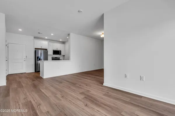 a kitchen with white cabinets and a sink