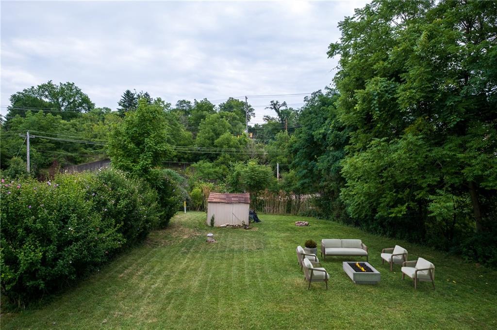 20 Sioux Road Pittsburgh, PA 15241 - Photo 4 of 25 a wooden bench sitting in the middle of a lush green field
