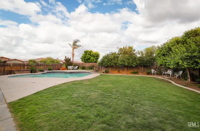 a view of a lake with houses in the back