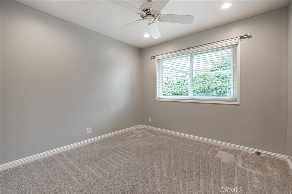 4580 Hazelnut Avenue Seal Beach, CA 90740 - Photo 22 of 35 an empty room with a window and a fan