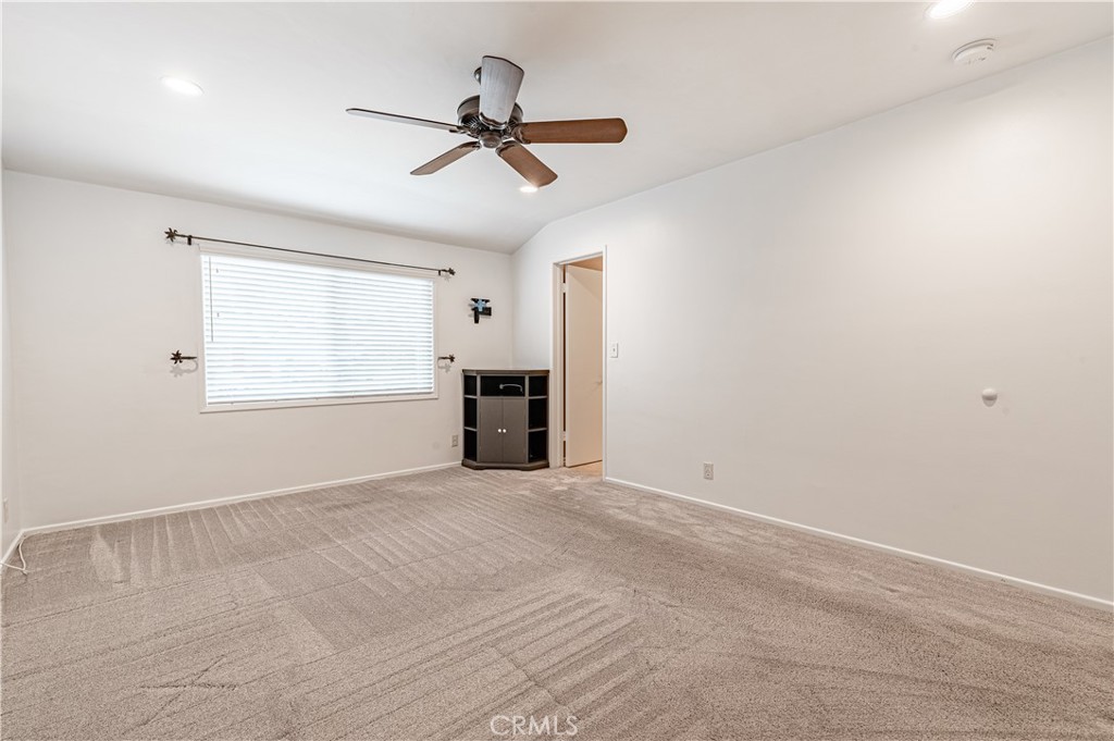 4580 Hazelnut Avenue Seal Beach, CA 90740 - Photo 27 of 35 a view of empty room with a ceiling fan and window