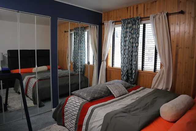 a bedroom with a bed and a window