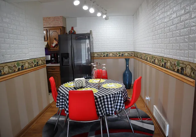 a dining room with furniture and window