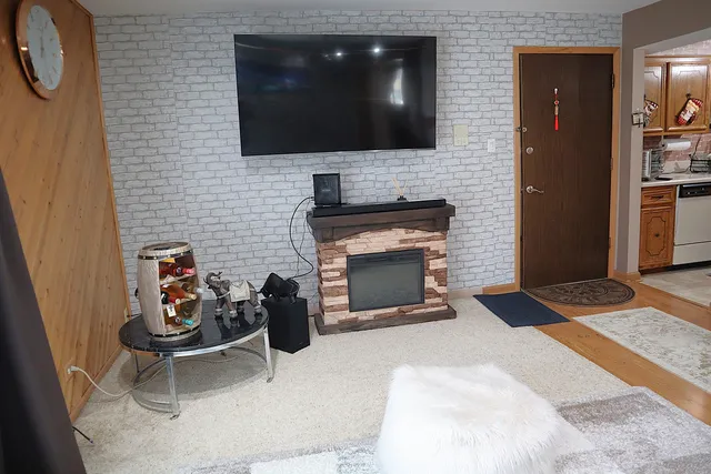 a living room with furniture and a fireplace