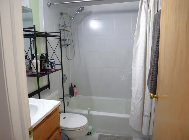 a bathroom with a toilet a sink and a bathtub