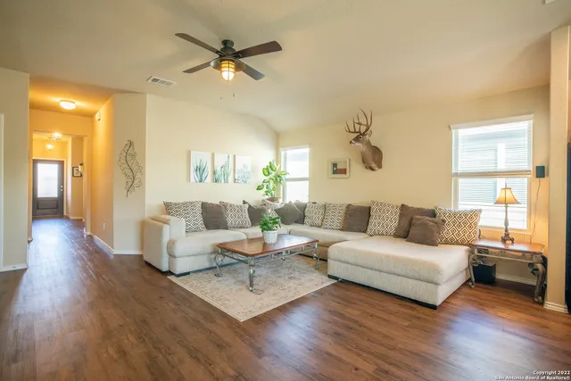 a living room with furniture and a large window