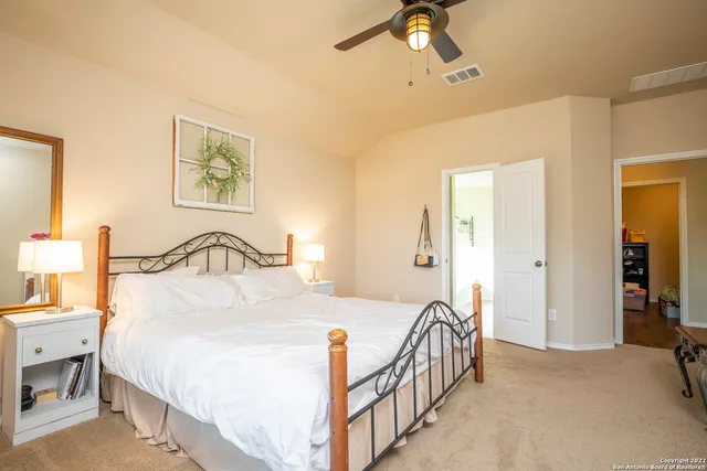 a bedroom with bed and a table