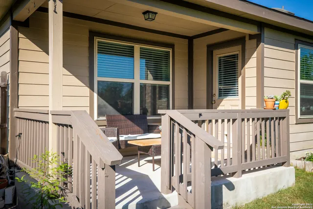 a view of deck with furniture and garden