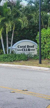 a view of a house with a yard and swimming pool