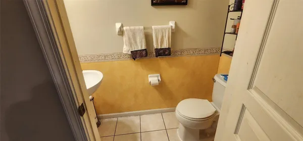 a bathroom with a sink a toilet and a shower