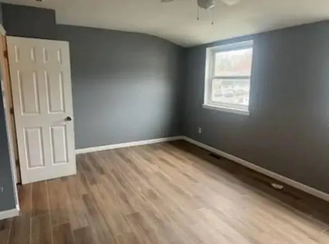 a bathroom with a toilet and shower
