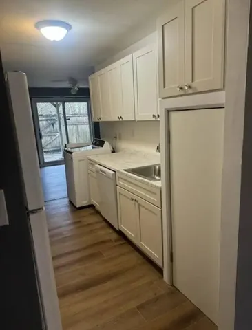 a kitchen with a refrigerator a sink and dishwasher