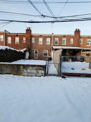 a view of a porch with a table and chairs