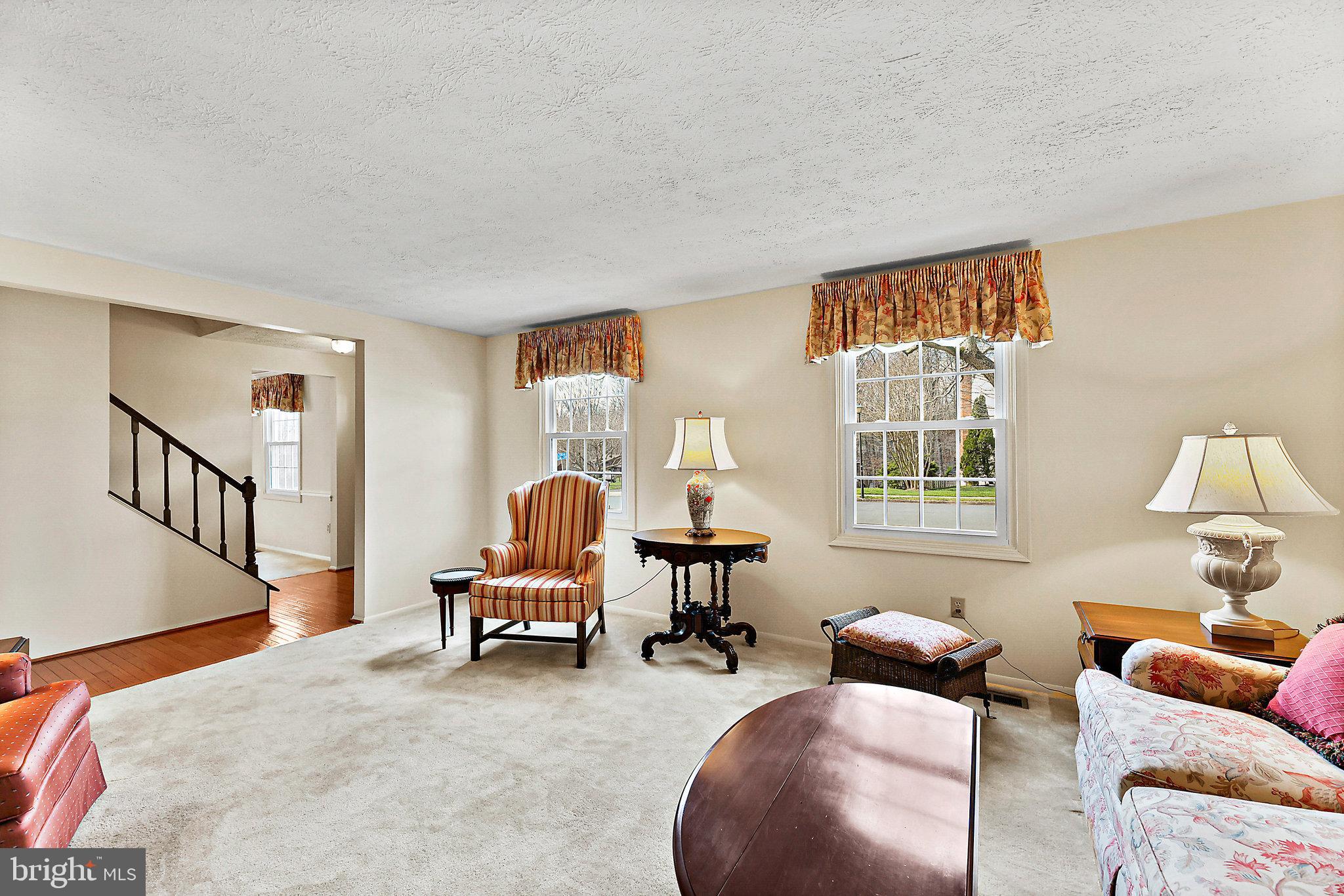 8470 Falling Leaf Road Springfield, VA 22153 - Photo 11 of 41 a living room with furniture and a window