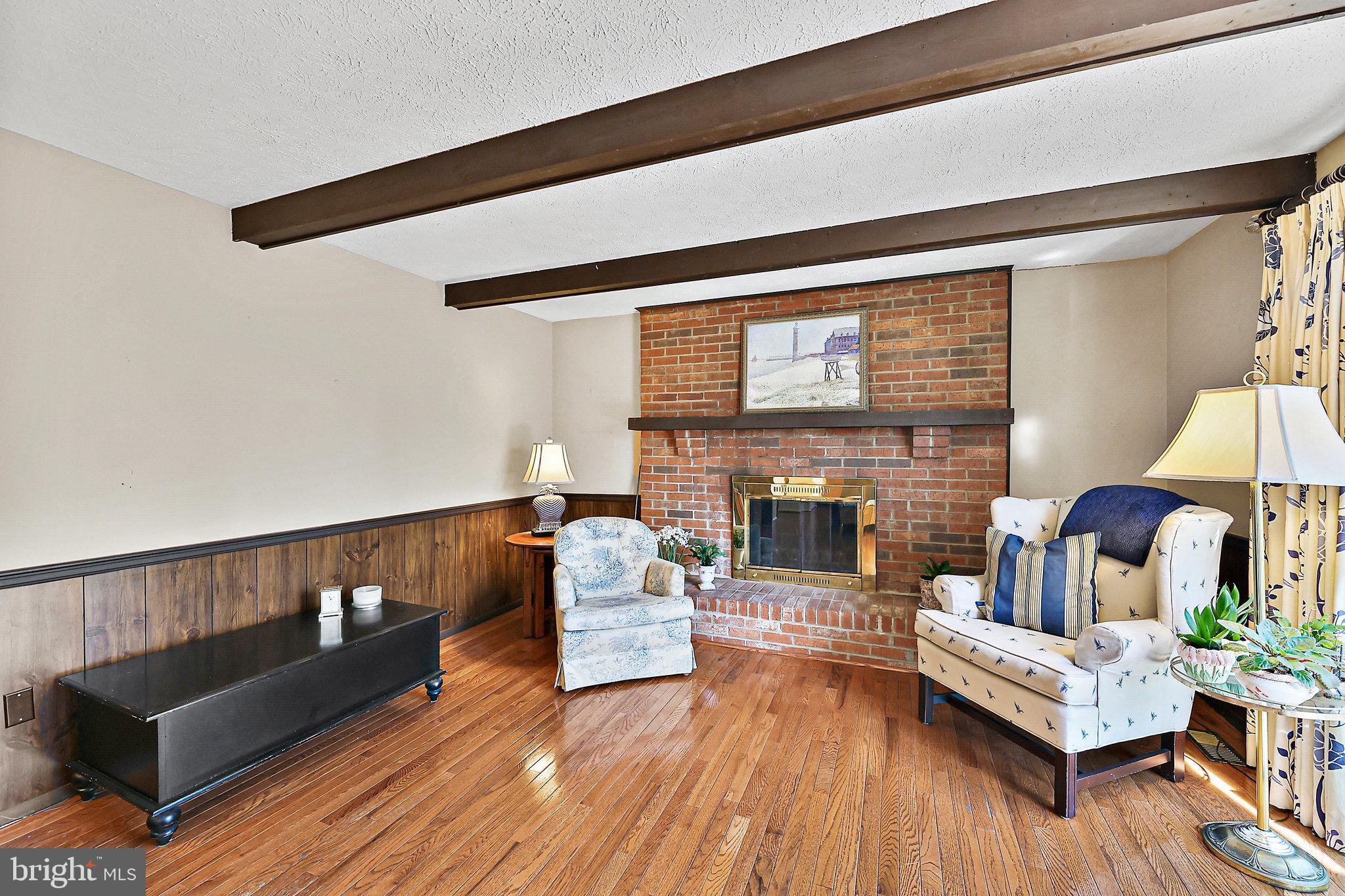 8470 Falling Leaf Road Springfield, VA 22153 - Photo 17 of 41 a living room with furniture and a fireplace