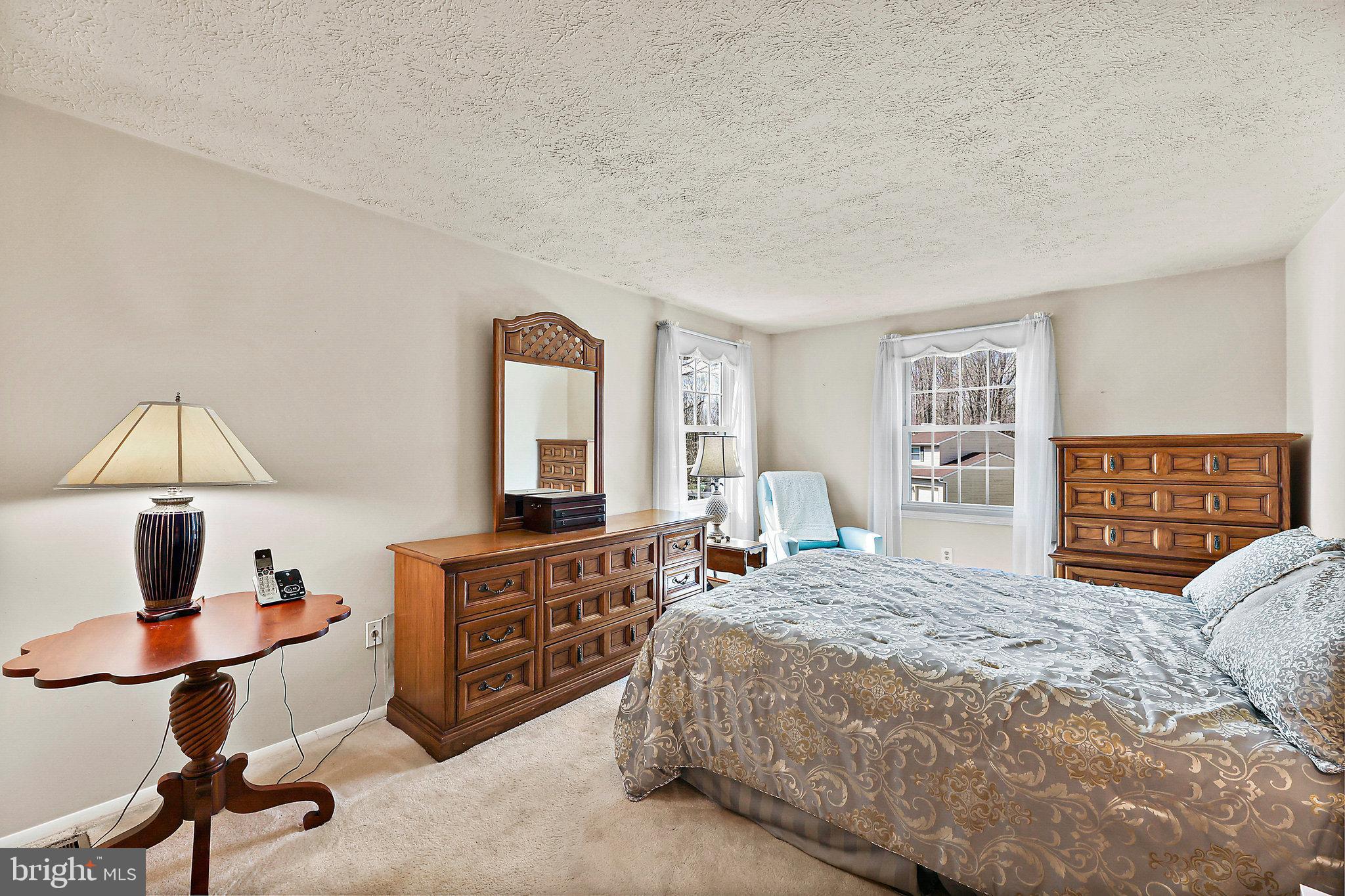 8470 Falling Leaf Road Springfield, VA 22153 - Photo 20 of 41 a bedroom with a large bed and a window