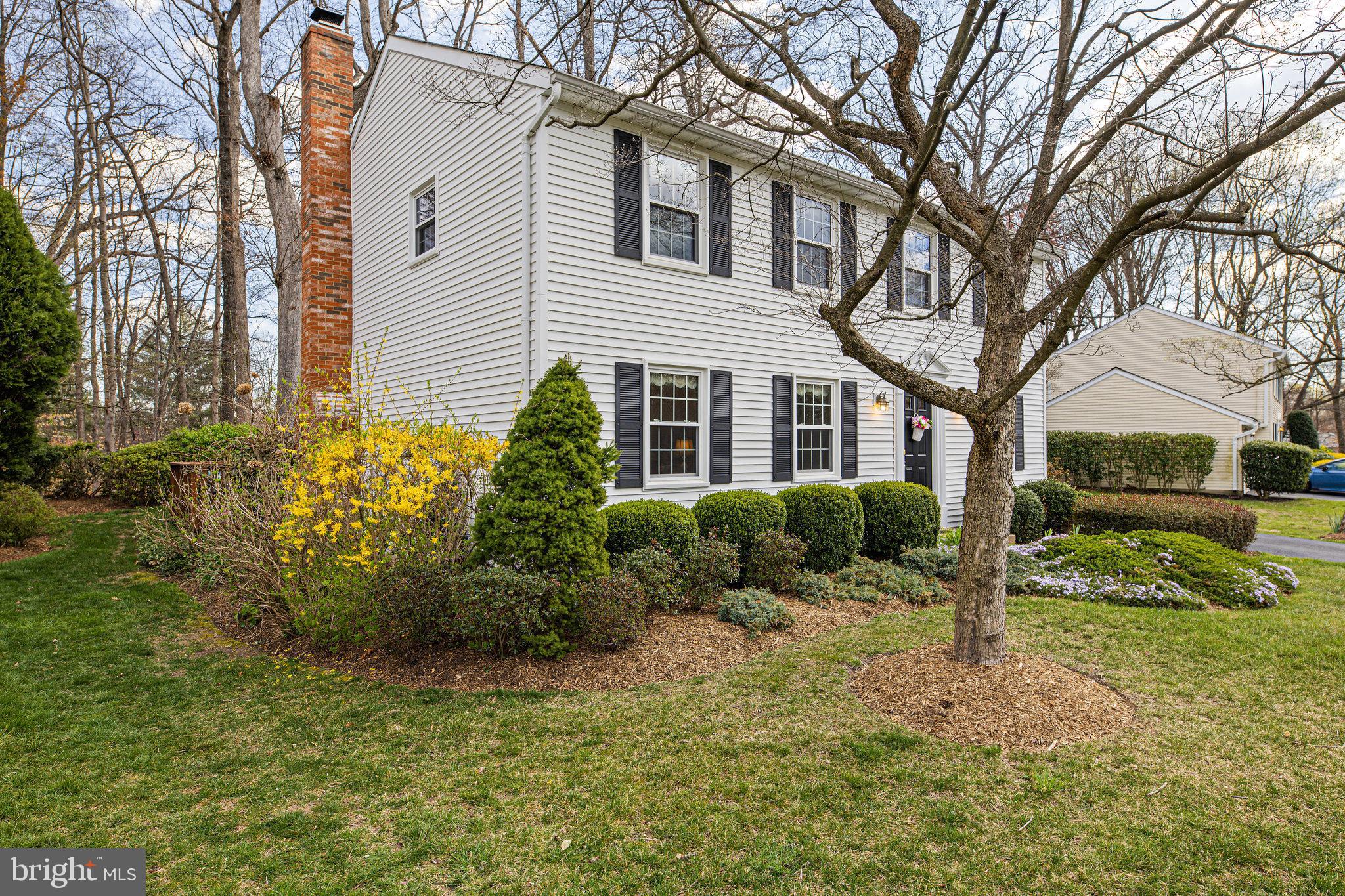 8470 Falling Leaf Road Springfield, VA 22153 - Photo 2 of 41 a front view of a house with a yard and garage