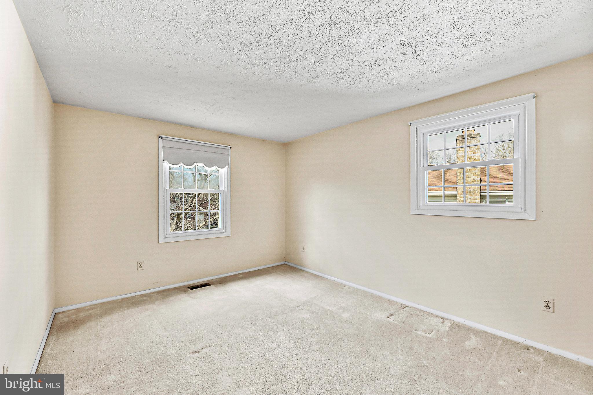 8470 Falling Leaf Road Springfield, VA 22153 - Photo 29 of 41 an empty room with windows