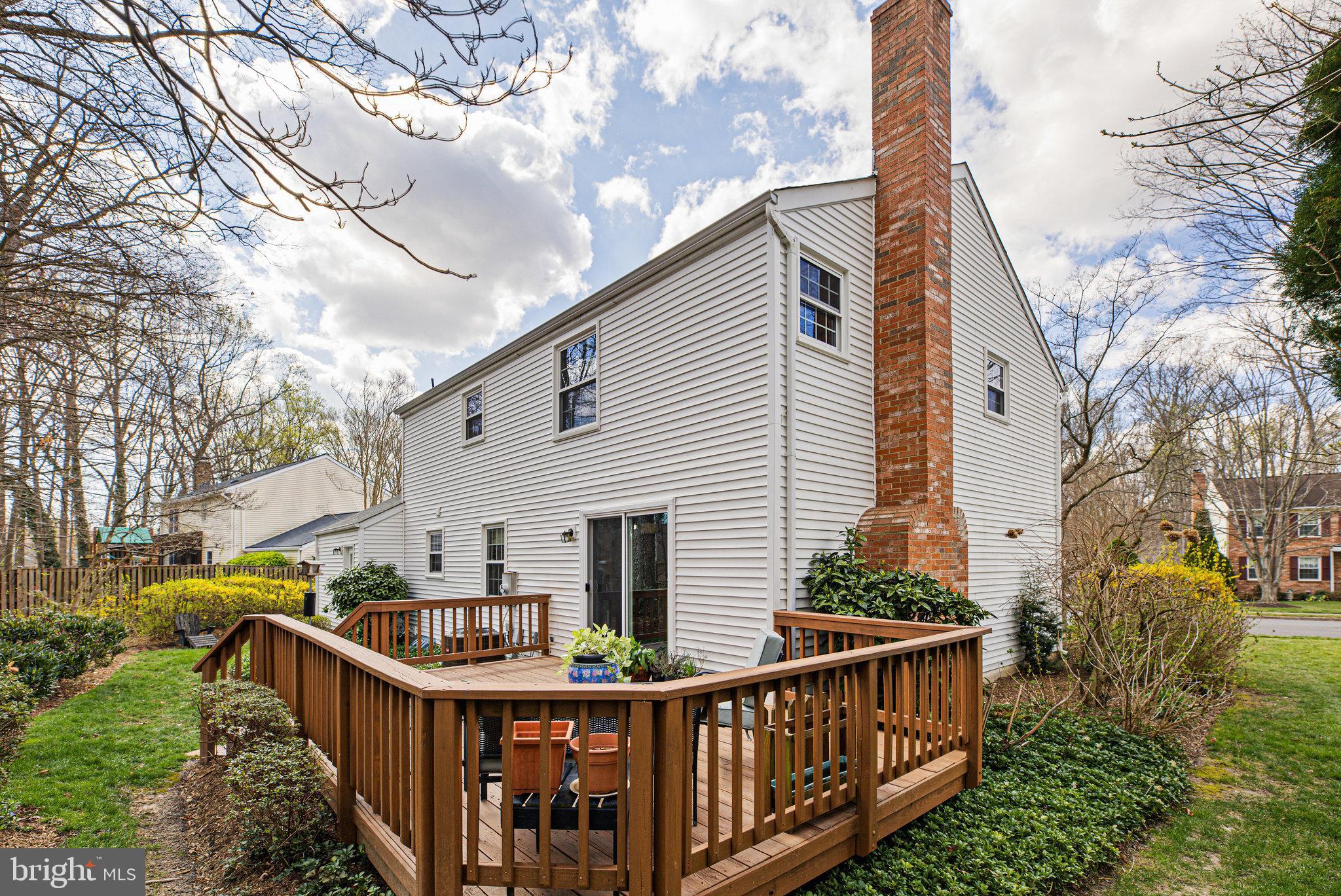 8470 Falling Leaf Road Springfield, VA 22153 - Photo 37 of 41 a view of house with a yard and furniture