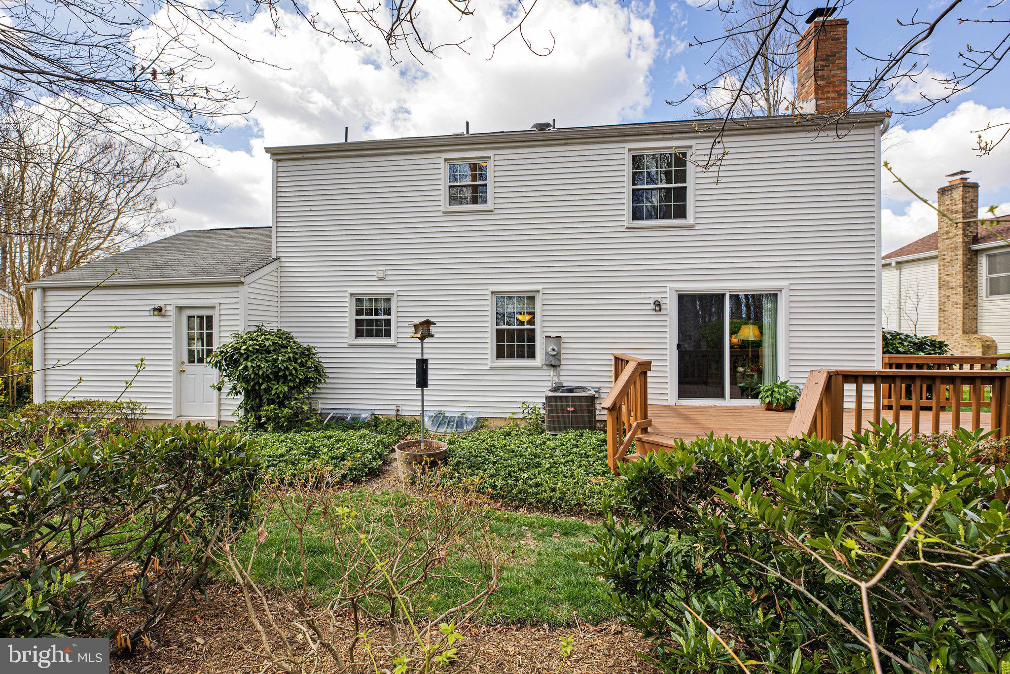 8470 Falling Leaf Road Springfield, VA 22153 - Photo 40 of 41 a front view of a house with balcony and garden