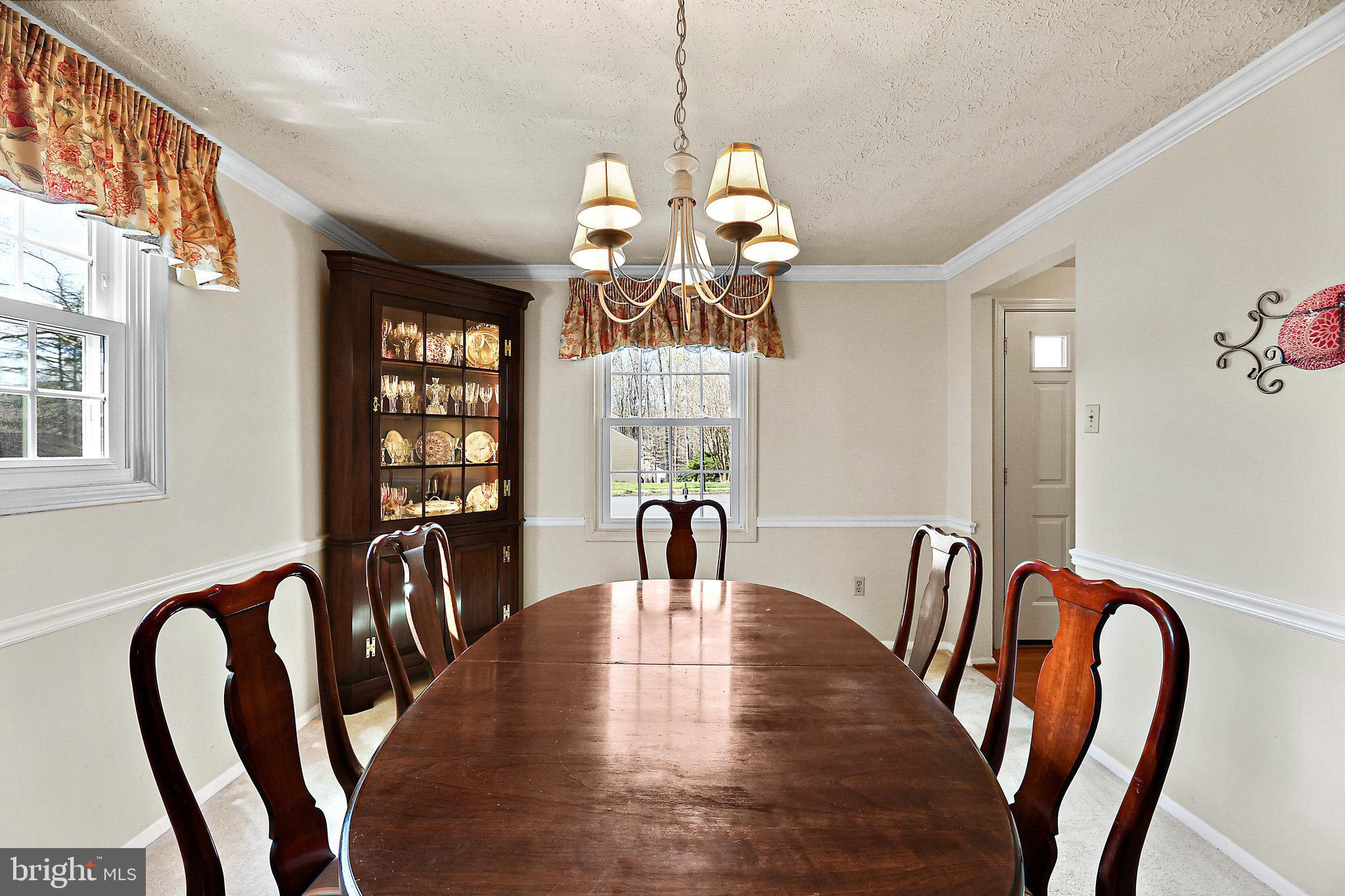 8470 Falling Leaf Road Springfield, VA 22153 - Photo 8 of 41 a view of a dining room with furniture window and wooden floor