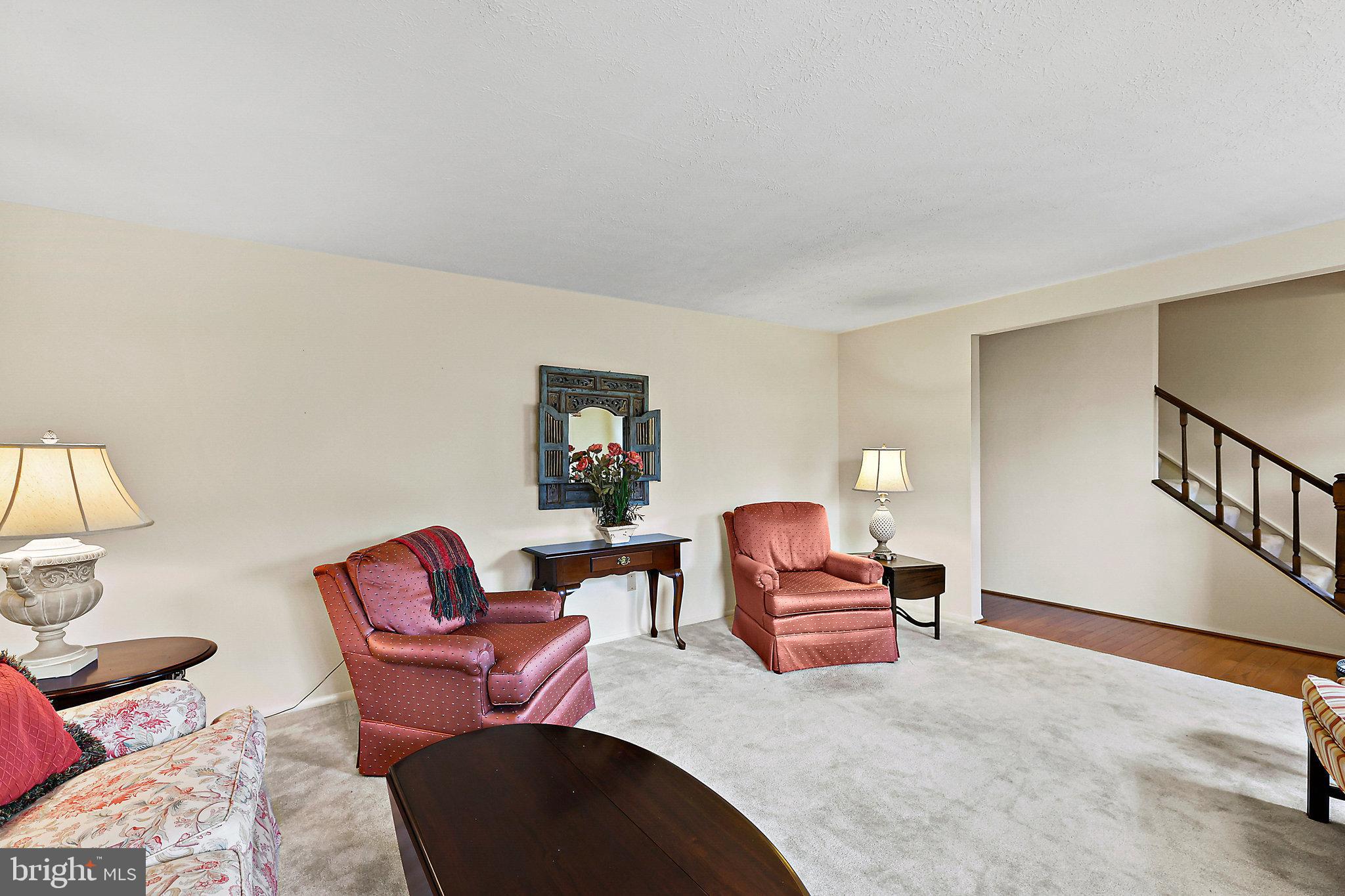 8470 Falling Leaf Road Springfield, VA 22153 - Photo 10 of 41 a living room with furniture and a window