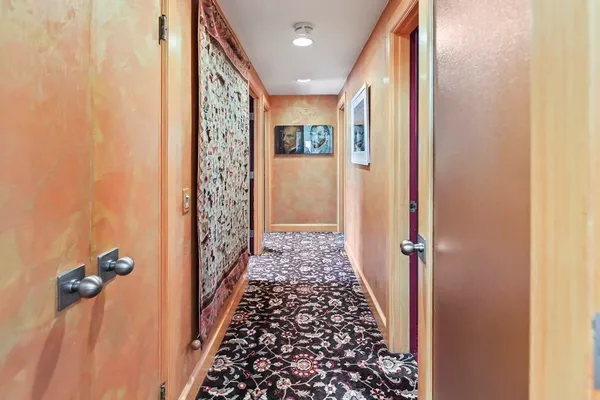 a bathroom with a large mirror and shower