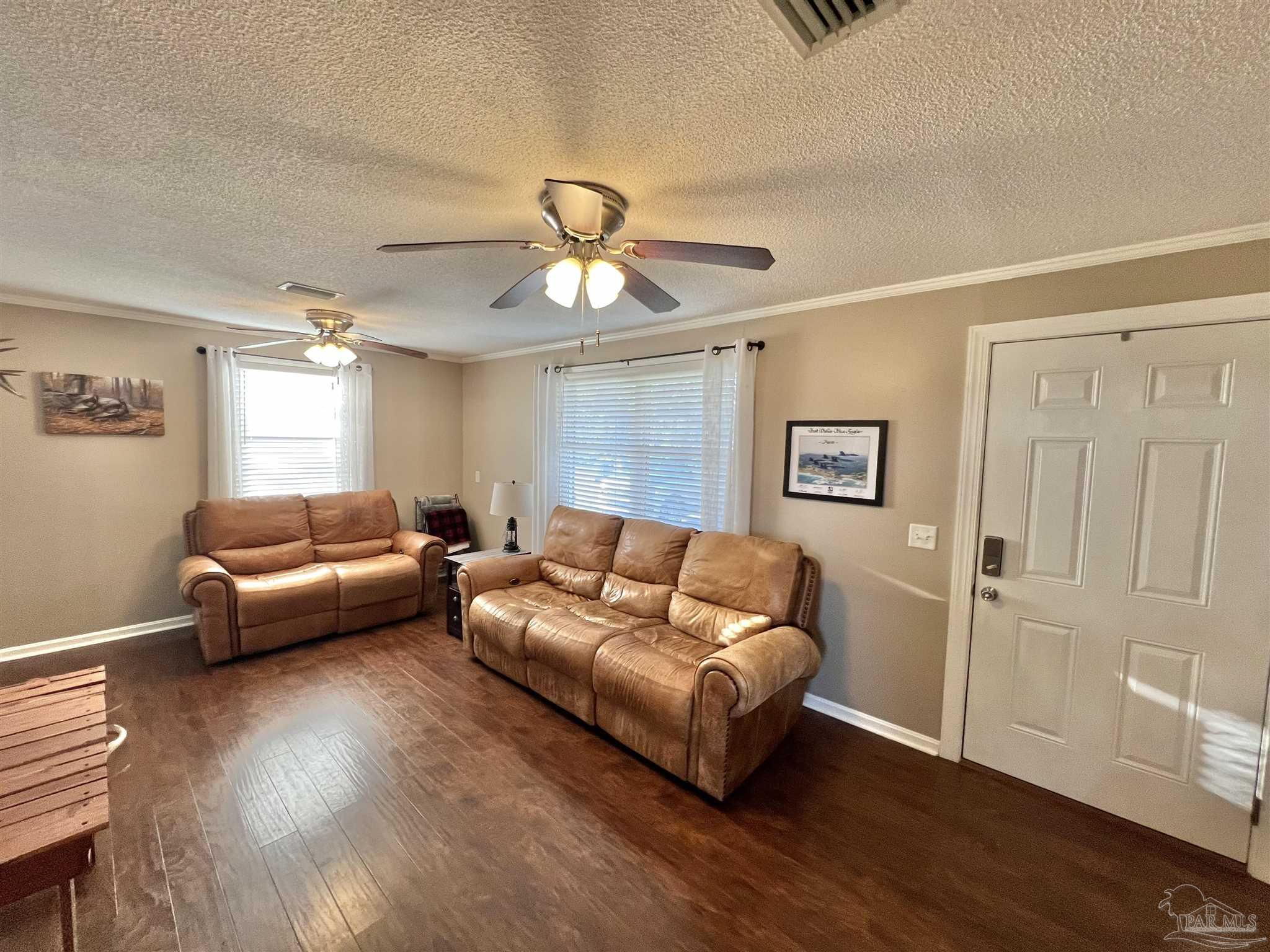 4075 Macks Road Century, FL 32535 - Photo 12 of 45 a living room with furniture and a wooden floor