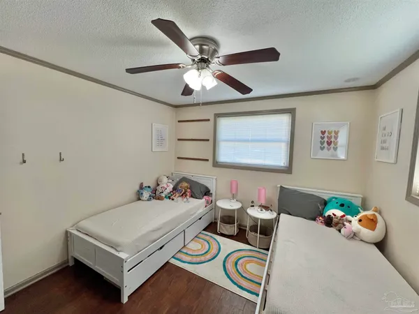 a bedroom with furniture and a window