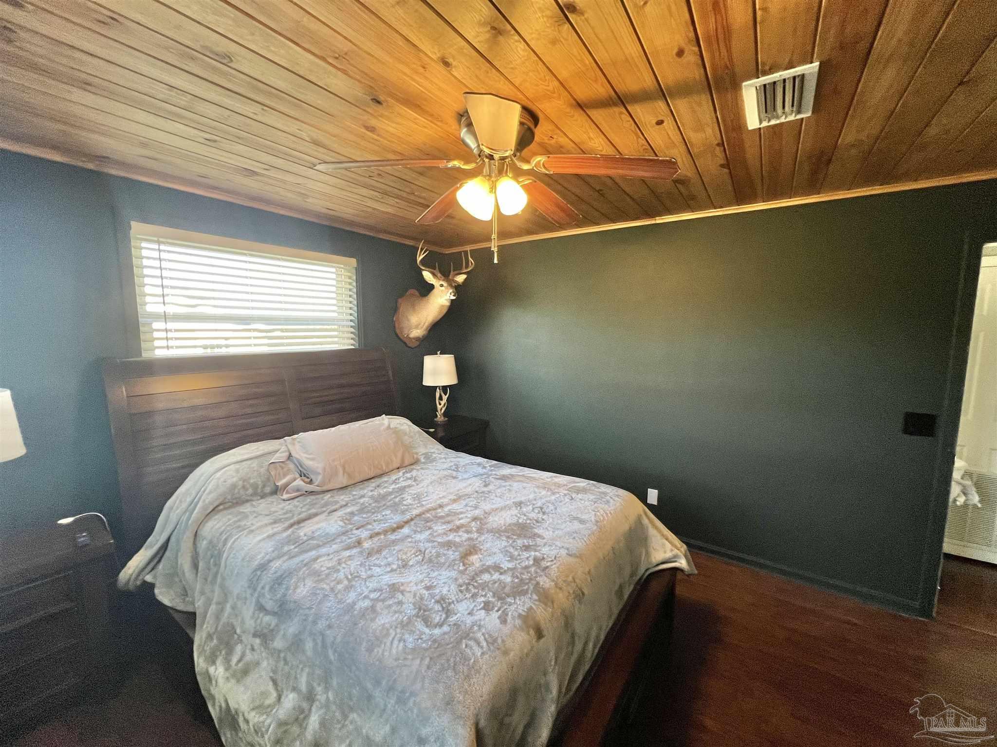4075 Macks Road Century, FL 32535 - Photo 20 of 45 a bedroom with a bed and a window