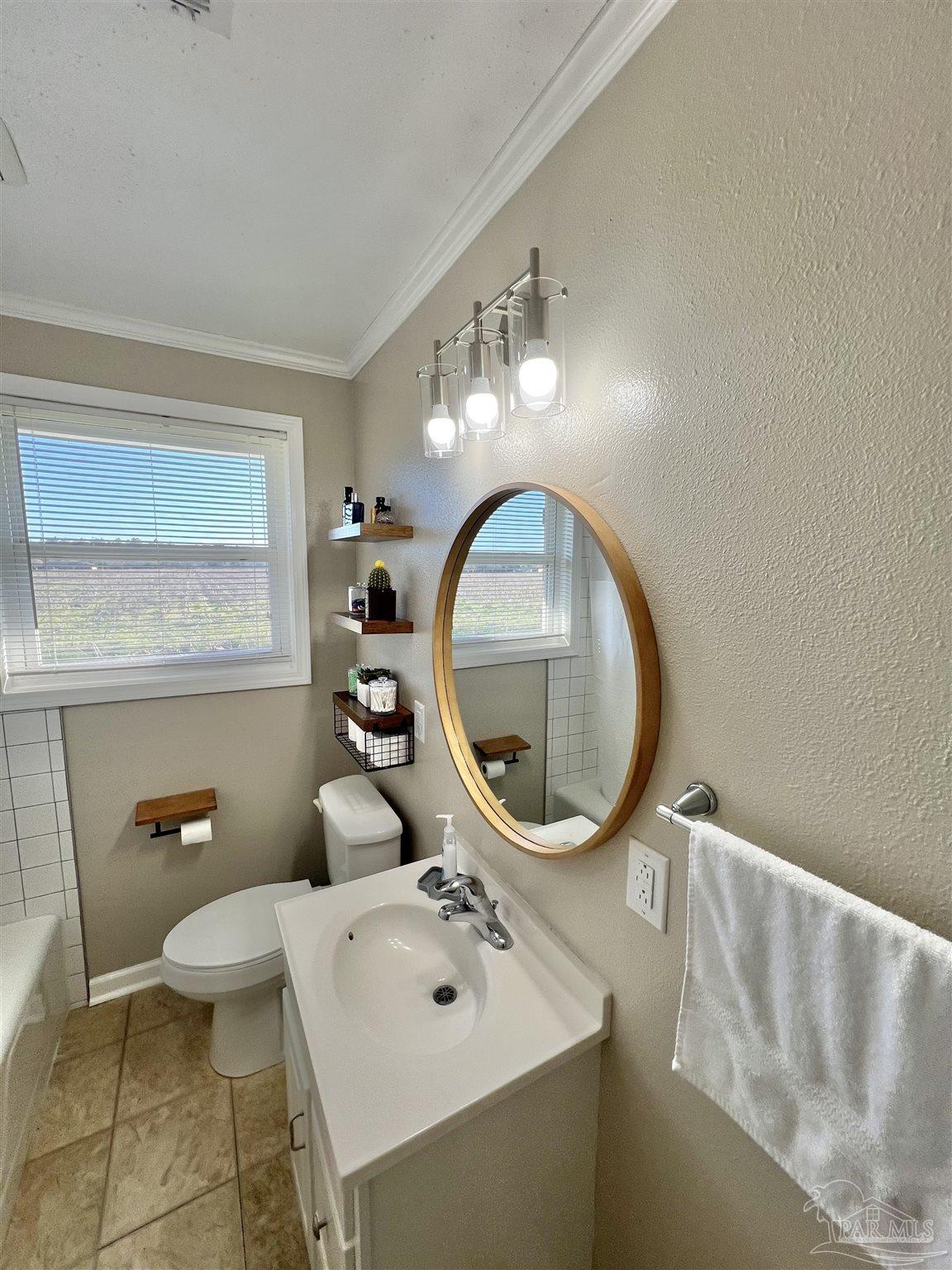 4075 Macks Road Century, FL 32535 - Photo 26 of 45 a bathroom with a sink and a mirror