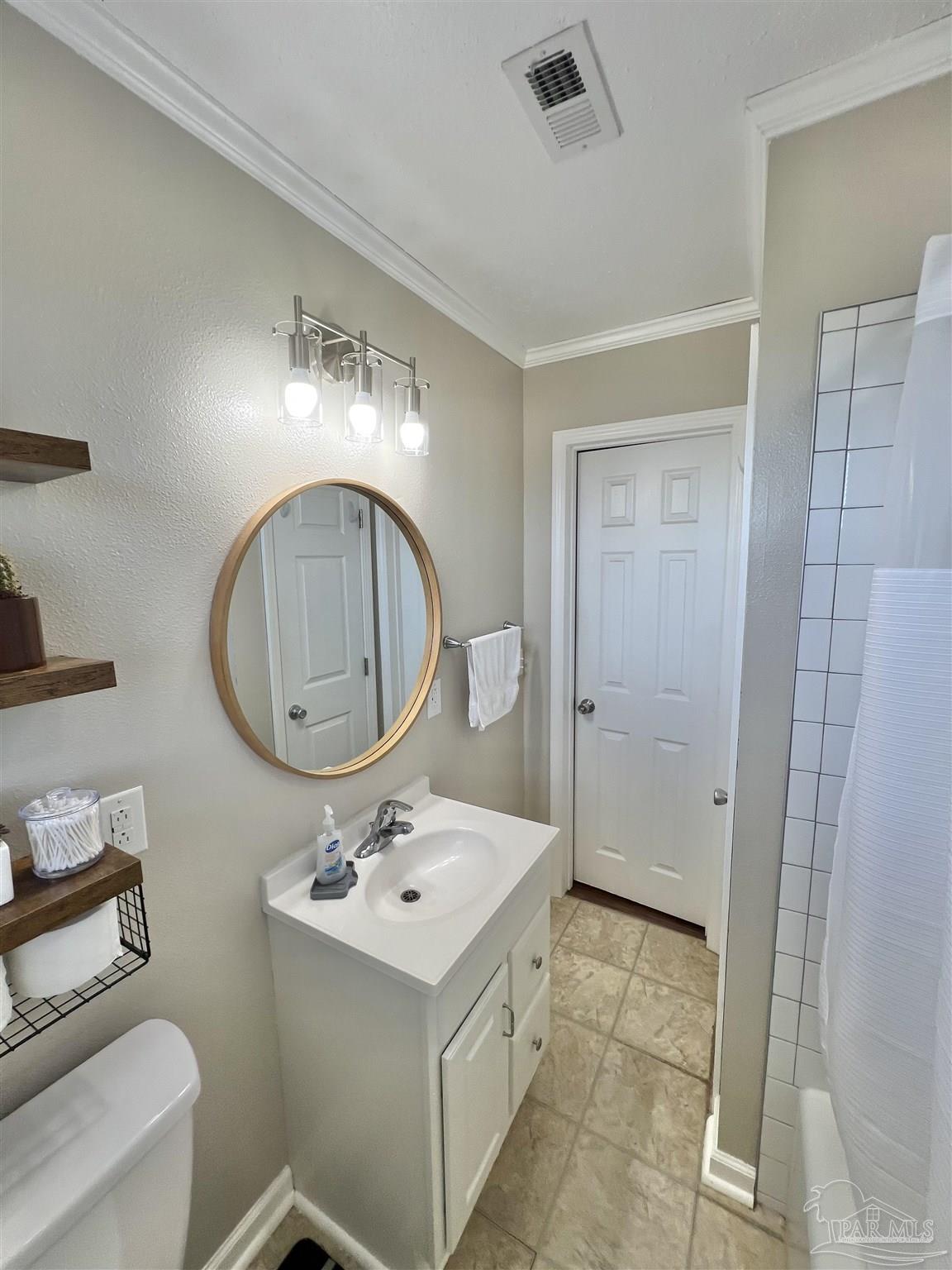 4075 Macks Road Century, FL 32535 - Photo 27 of 45 a bathroom with a sink mirror and vanity
