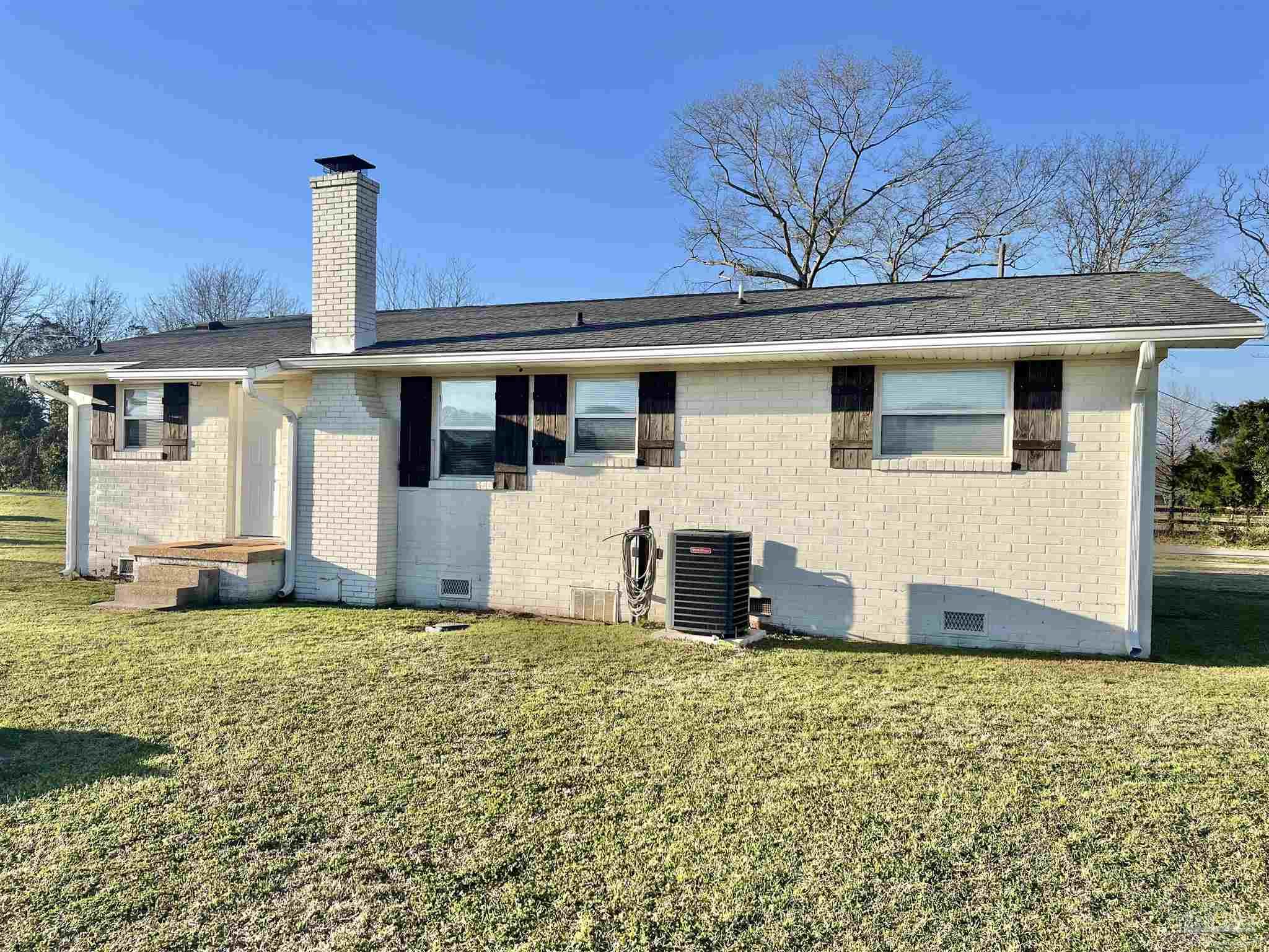4075 Macks Road Century, FL 32535 - Photo 28 of 45 a house that has a tree in front of it
