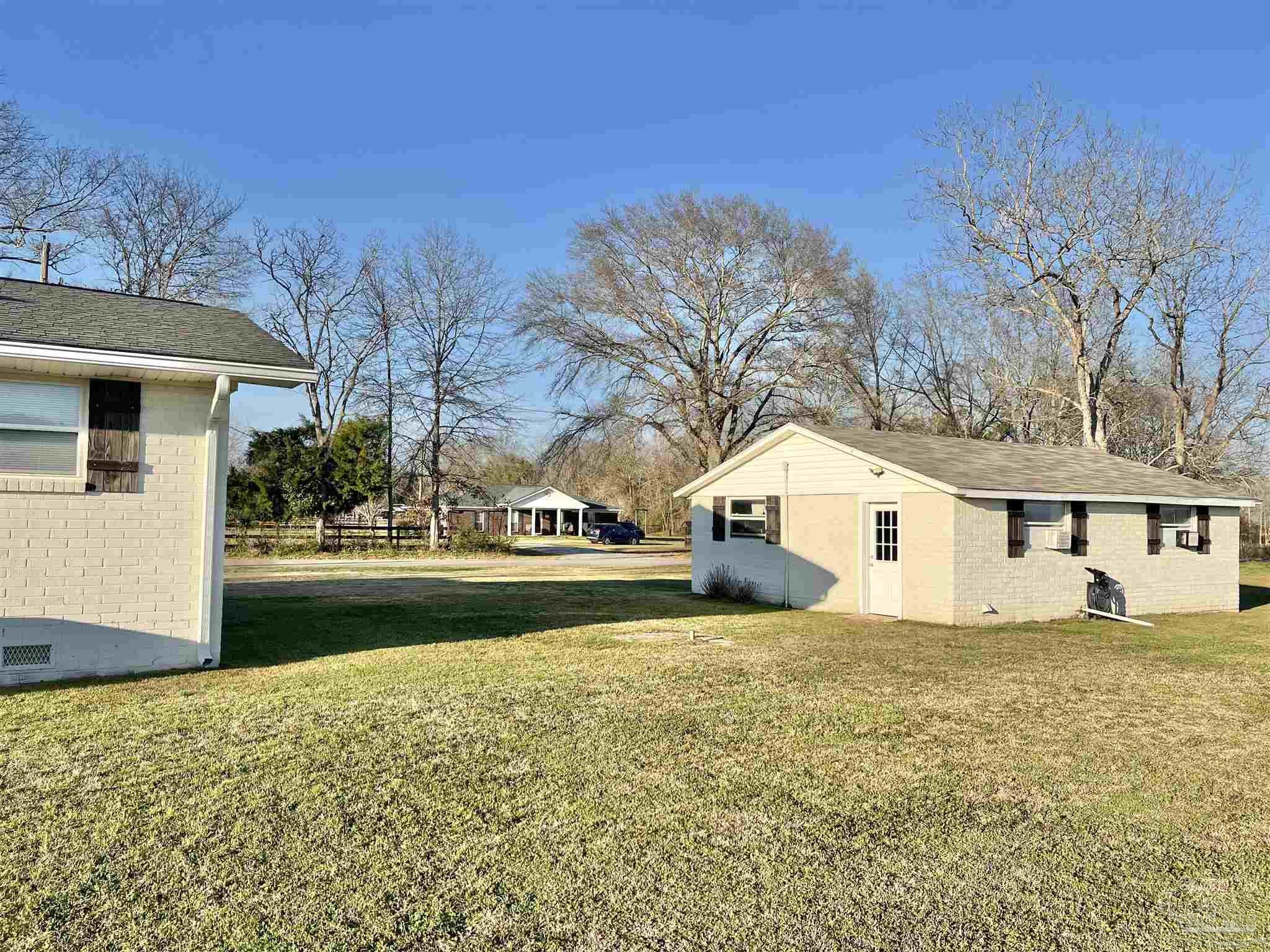 4075 Macks Road Century, FL 32535 - Photo 30 of 45 a view of a house with a yard