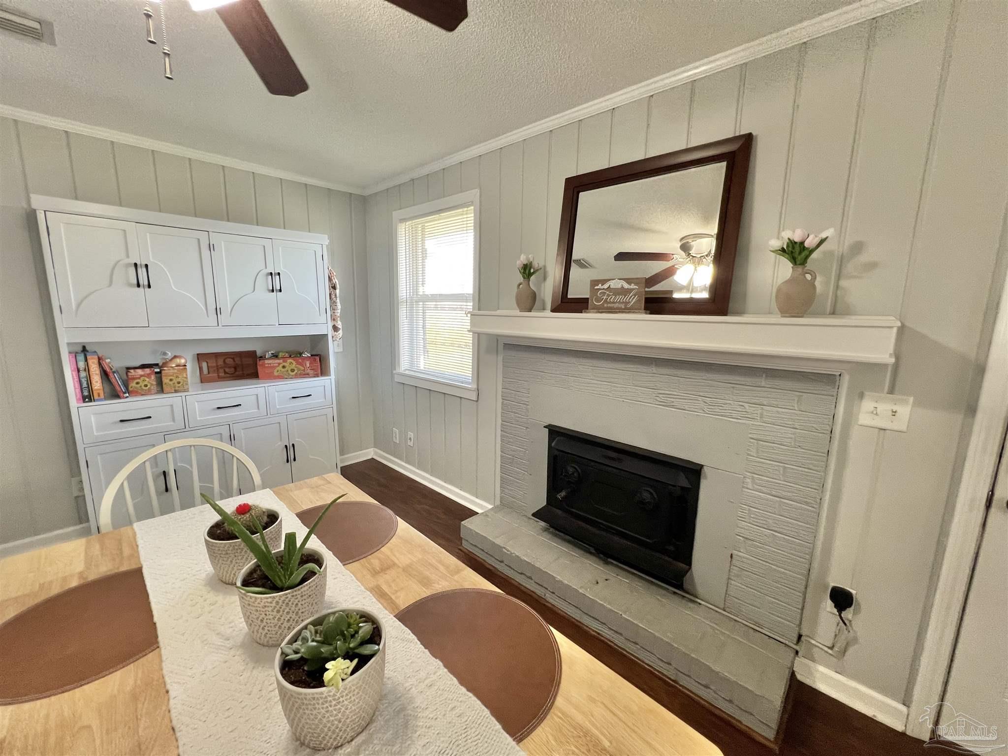 4075 Macks Road Century, FL 32535 - Photo 3 of 45 a living room with furniture fireplace and flat screen tv