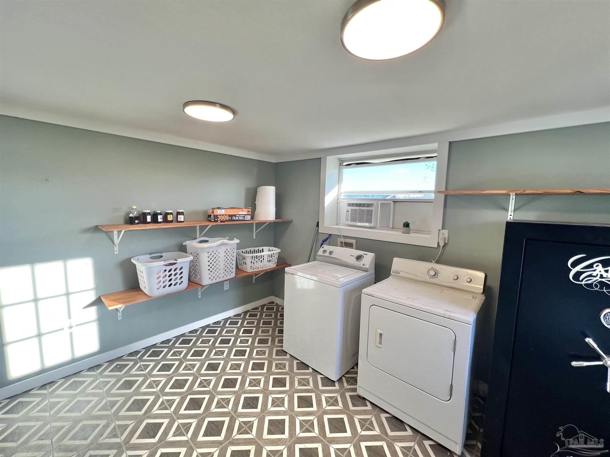 4075 Macks Road Century, FL 32535 - Photo 37 of 45 a storage room with washer and dryer