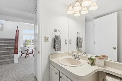 a bathroom with a sink double vanity and a mirror