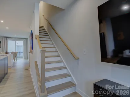 a bedroom with a bed and a television