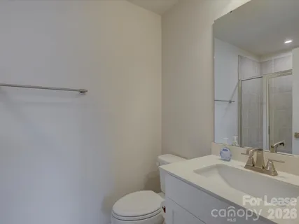 a view of roof deck with furniture and city view