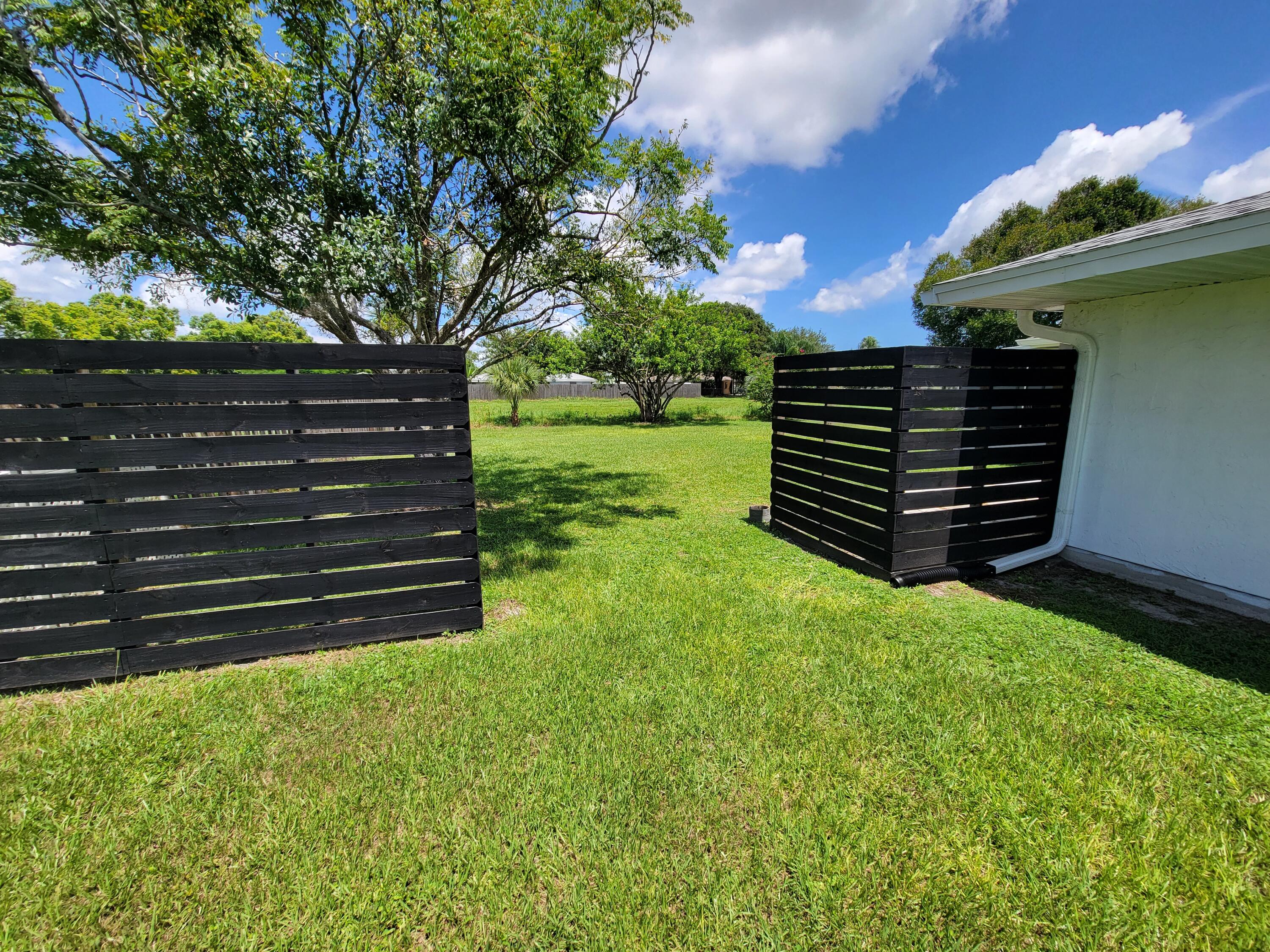881 Riviera Drive Northeast Palm Bay, FL 32905 - Photo 26 of 35 Side Fence