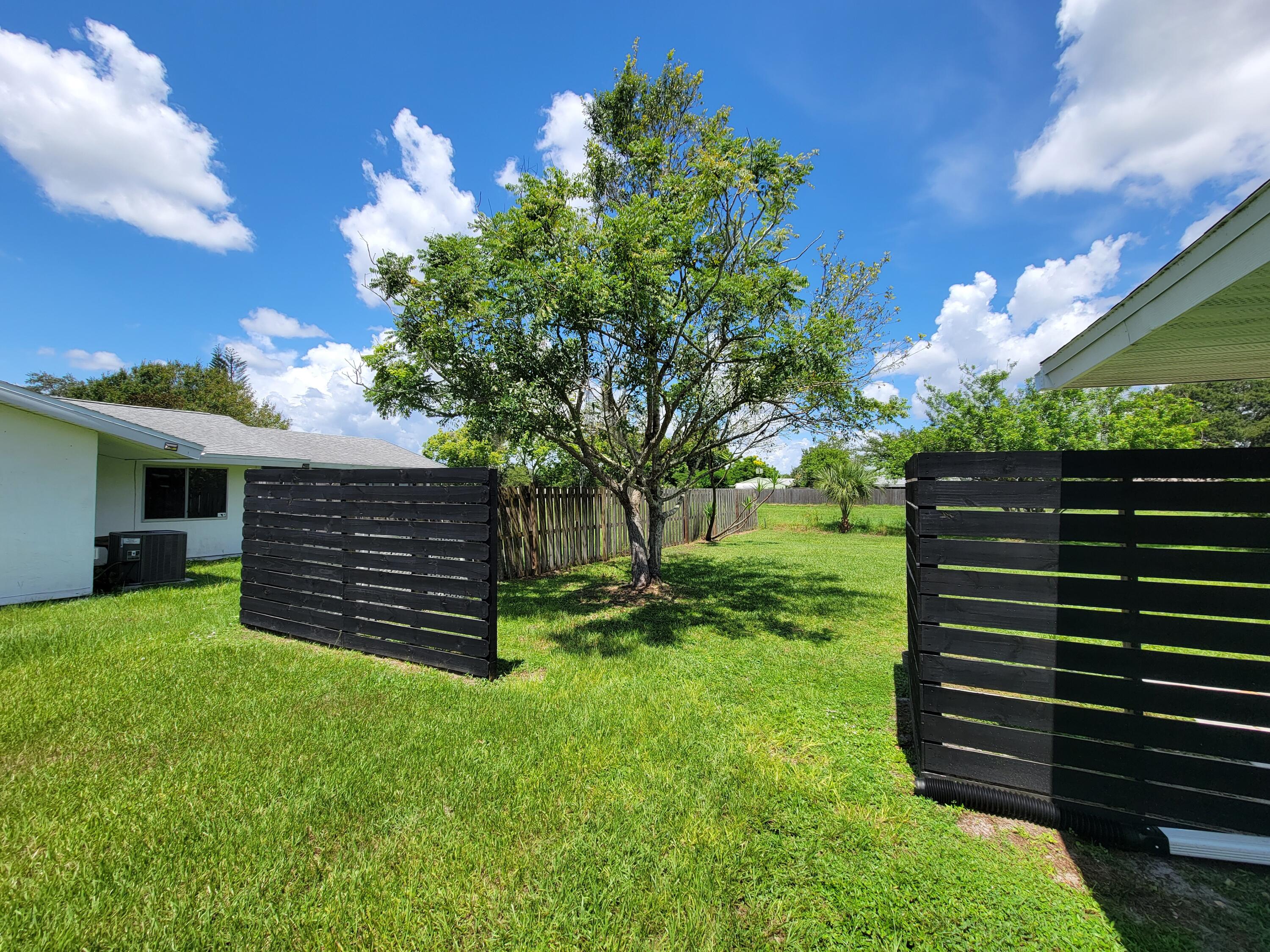 881 Riviera Drive Northeast Palm Bay, FL 32905 - Photo 27 of 35 Side Fence
