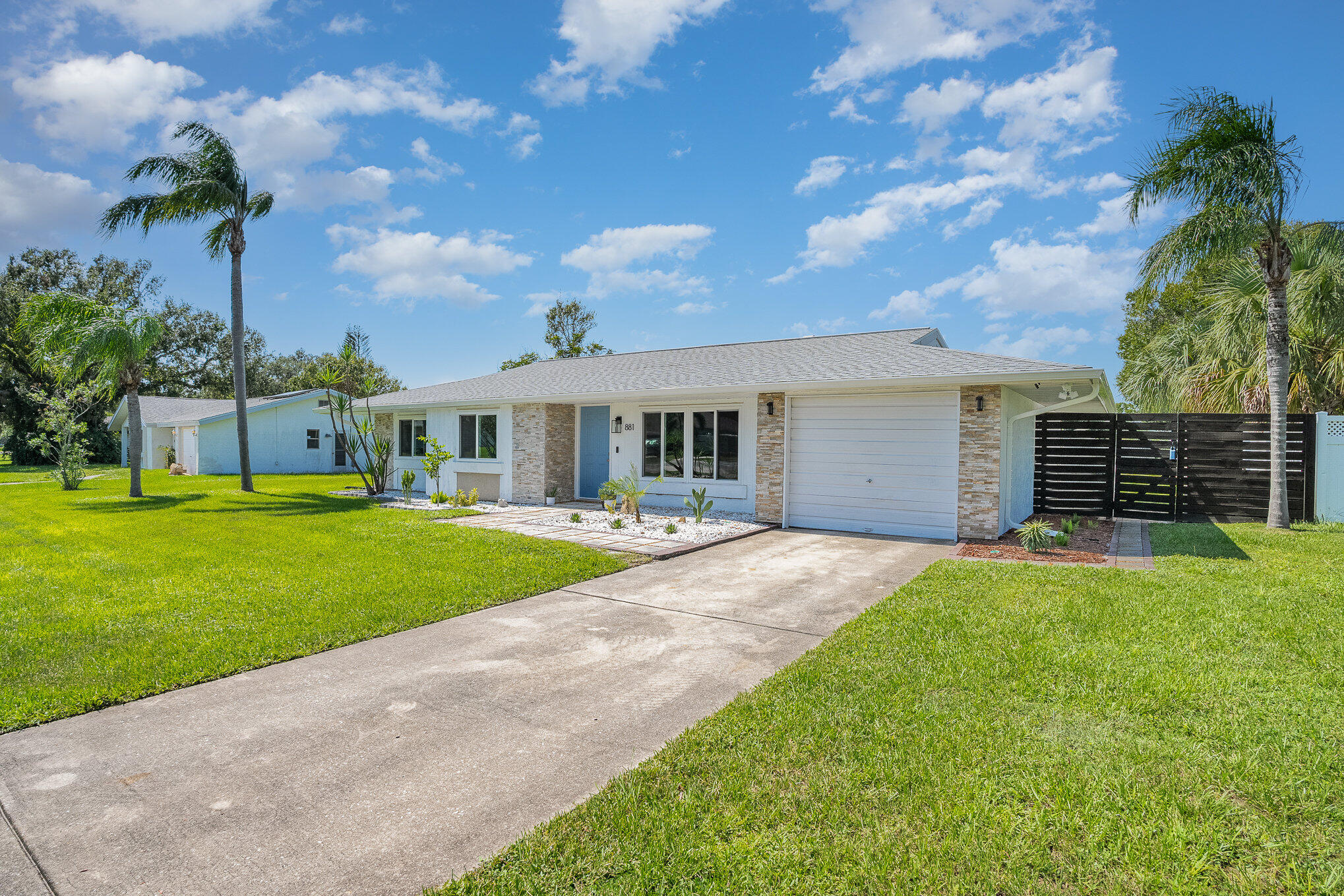 881 Riviera Drive Northeast Palm Bay, FL 32905 - Photo 3 of 35 Long Driveway