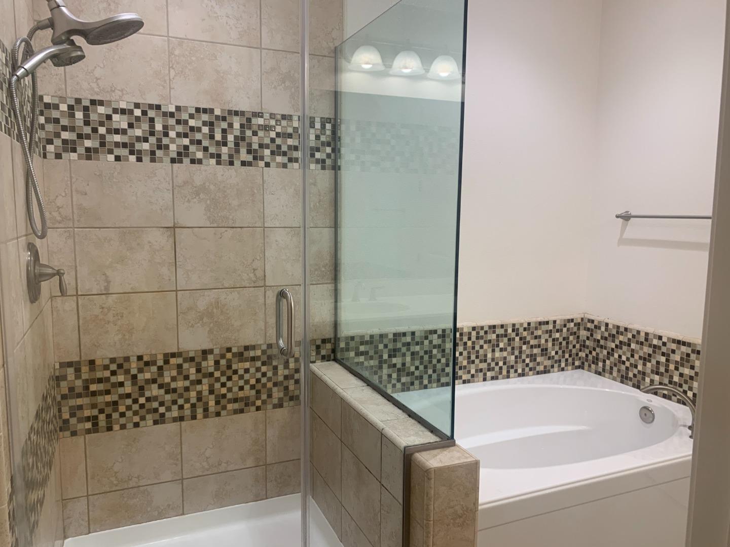 388 Expedition Lane Milpitas, CA 95035 - Photo 9 of 18 a bathroom with a bathtub and shower
