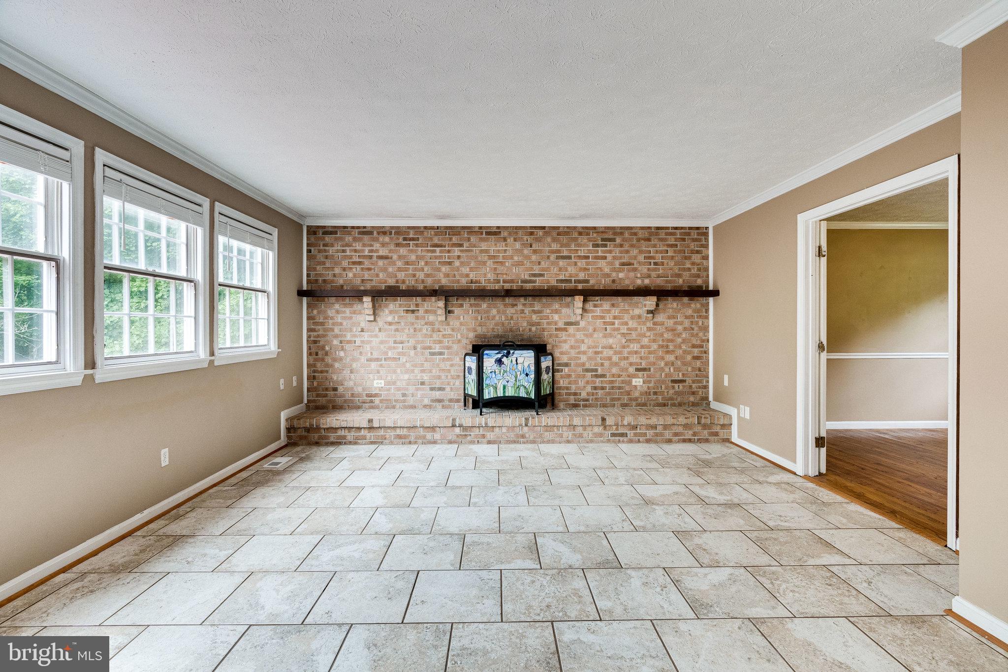 13221 Wates Spring Place Clifton, VA 20124 - Photo 16 of 68 Family Room w/wall-length brick hearth & fireplace