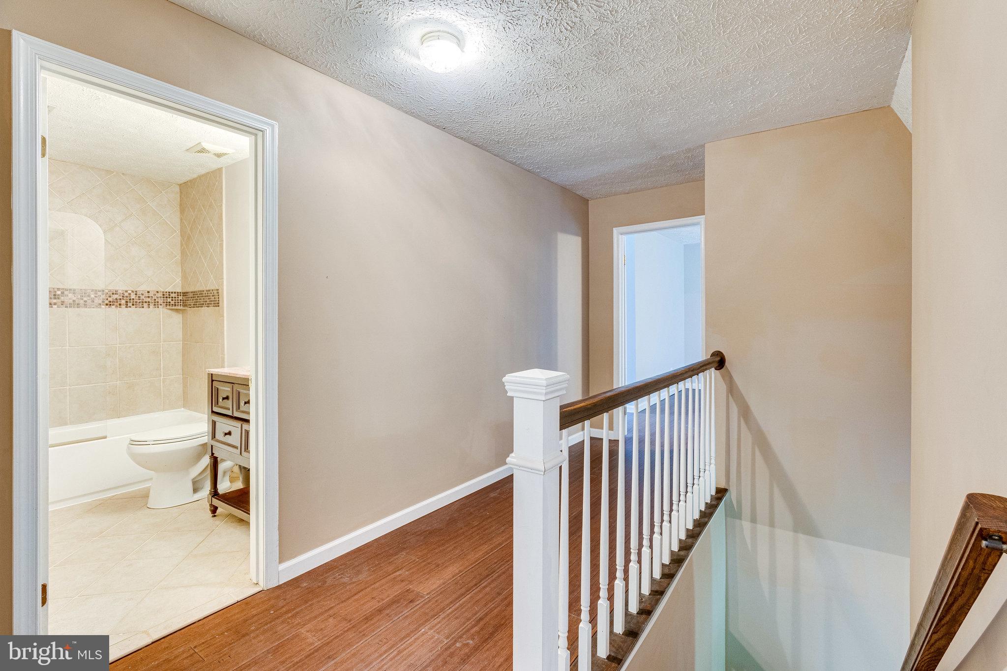13221 Wates Spring Place Clifton, VA 20124 - Photo 20 of 68 Upper Level Hall. Gorgeous engineered hardwoods!