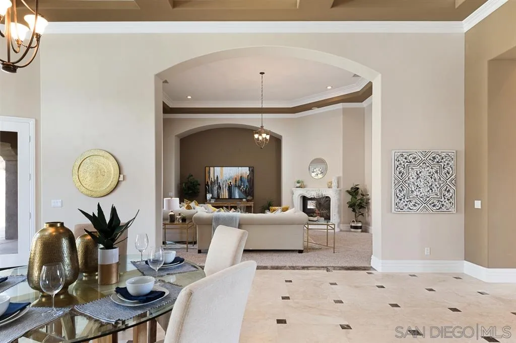 28310 Vía Santa Rosa Temecula, CA 92590 - Photo 11 of 23 a living room with furniture a mirror and white walls