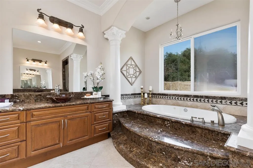 28310 Vía Santa Rosa Temecula, CA 92590 - Photo 18 of 23 a large bathroom with a large tub sink and mirror