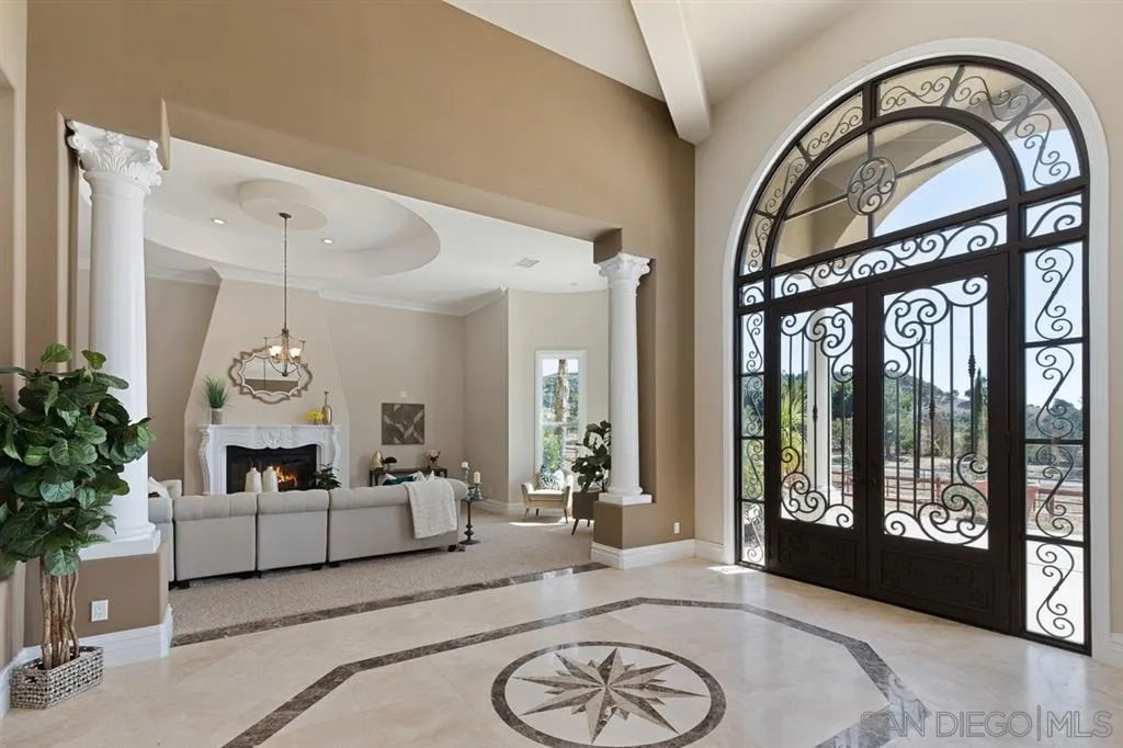 28310 Vía Santa Rosa Temecula, CA 92590 - Photo 6 of 23 a living room with furniture a potted plant and a large window